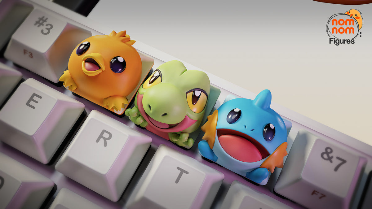 Keycaps de resina Treecko, Torchic y Mudkip en teclado
